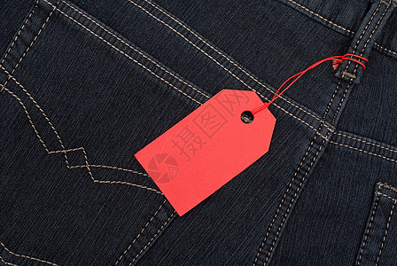 牛仔裤拖质价格标签按钮工人红色纺织品棉布细绳织物衣服材料接缝图片