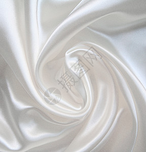 作为婚礼背景的平滑优雅白色丝绸织物材料银色曲线涟漪折痕投标布料新娘纺织品图片