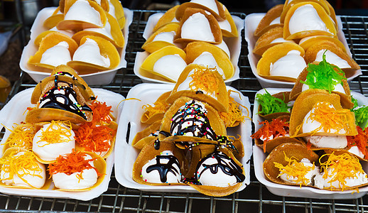 泰国甜点风格橙子糖果奶油饼子绿色糖类巧克力蜜饯市场食物图片