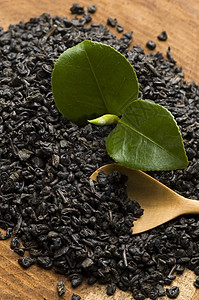东方清茶和干茶绿色白色木头黑色药品宏观享受单宁叶子文化背景