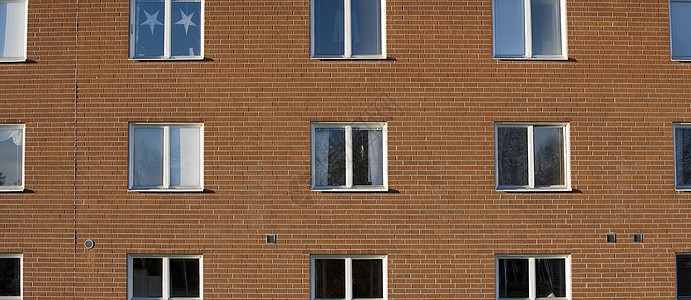 公寓楼建筑学红色种植房地产建筑蓝天园景橙子天空住宅小区图片