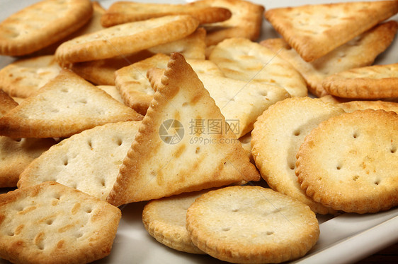 饼干食物盐渍团体小吃圆形宏观饮食小麦棕色面包图片