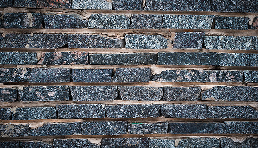 花岗岩墙墙矿物建筑石头岩石材料棕色干旱框架地面宏观图片