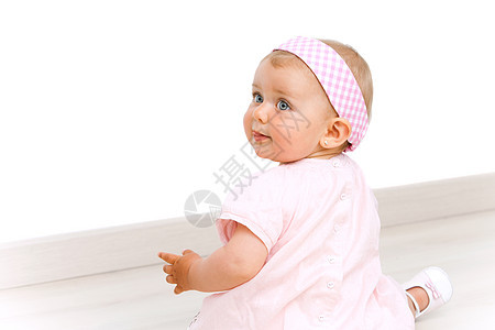 粉红色头领带的可爱女婴肖像图片