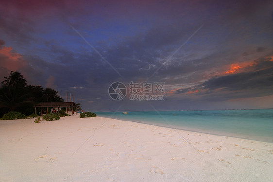 马尔代夫的日落船厂码头热带旅游反射海岸假期太阳港口日出图片