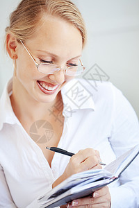 商业妇女快乐商务眼镜工作女士女孩女性写作经理人士图片