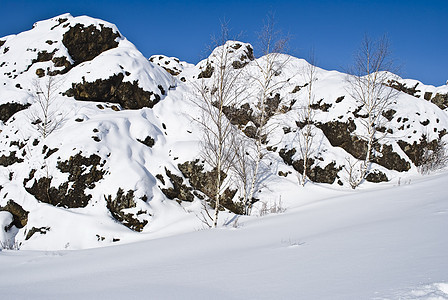 雪山人行道冻结石头天空白色蓝色日光爬坡天气图片