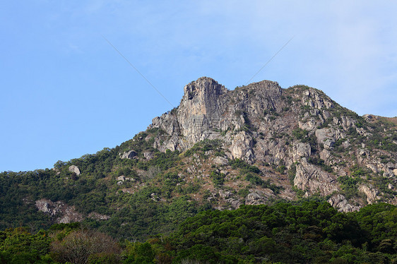 香港的狮子石蓝色狮子精神绿色岩石头脑天空地标城市晴天图片