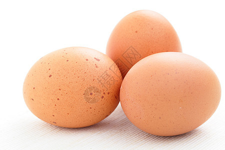 三个鸡蛋美食棕色营养早餐黄色食物椭圆形阴影母鸡家禽图片