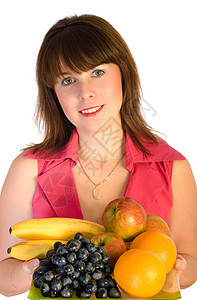 带着水果盘子的美丽笑容美丽的女孩饮食香蕉女士成人食物烹饪眼睛服务器营养橙子图片