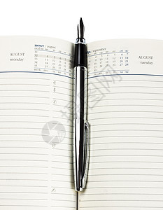 钢笔在日记上配饰日历程序桌子日志办公室蓝色邮票皮革笔记图片