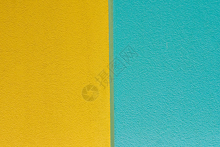黄墙和蓝色油漆墙背景图片
