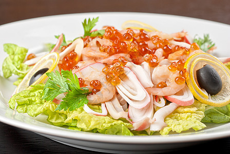 海沙拉飞行鱿鱼餐厅盘子草药海鲜奇异果树叶贝类水果图片