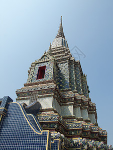 泰国寺庙的佛教和泰国艺术风格星星射线建筑学教会旅行天空文化雕像辐射橙子图片