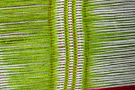 制造绿色背景针织品手工织物毛衣环形制造商材料羊毛纤维棉布图片