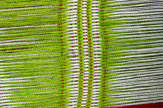 制造绿色背景针织品手工织物毛衣环形制造商材料羊毛纤维棉布图片