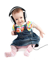 小可爱的小女孩女性幸福白色耳机婴儿微笑女孩孩子童年乐趣图片