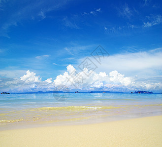 沙滩和热带海海景放松太阳天堂海浪蓝色假期冲浪支撑旅行图片