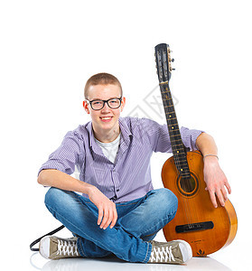 具有经典西班牙语吉他男孩停留学习音乐家年轻人艺术乐趣男性吉他教育蓝色图片