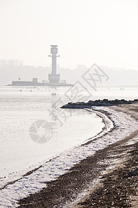 灯塔强光致盲海滩太阳地标建筑海事阳光海岸逆光背景图片