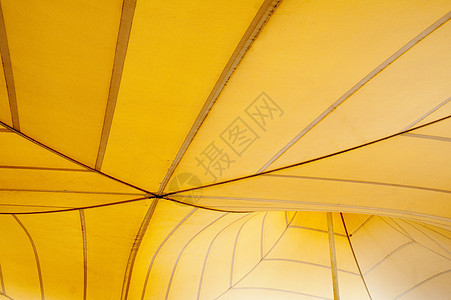 黄黄帐篷灯泡建造帆布线条天篷圆顶拉伸黄色阳光织物背景图片