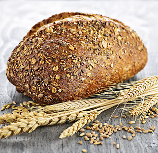 多谷物面包卷棕色小麦内核杂粮包子食物拓荒者硬皮脆皮种子图片
