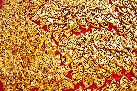 墙上土生土生土长的Thai风格的黄金图科设计叶子雕刻传统古董石膏装饰浮雕艺术工艺装饰品图片