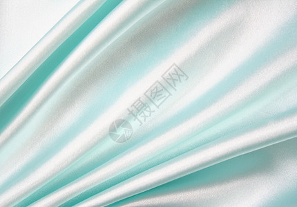 平滑优雅的蓝色丝绸作为背景银色奢华织物纺织品投标材料布料艺术生产感性图片