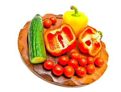 切割板上的蔬菜胡椒食物辣椒砧板棕色红色素食者绿色健康黄瓜图片