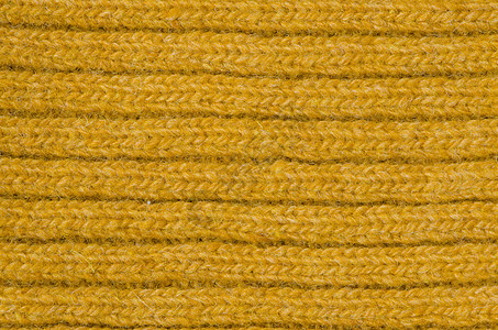 黄羊毛纹理精纺套衫纺织品橙子针织材料黄色网格服装服饰图片