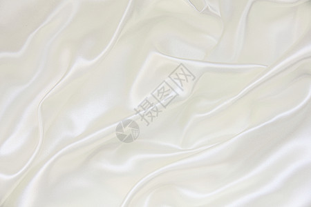 平滑优雅的白色丝绸作为背景纺织品投标织物海浪婚礼涟漪感性折痕新娘布料图片