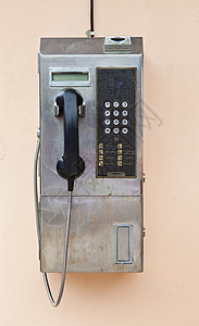 墙上的付费电话电子金属按钮硬币电讯民众绳索讲话公用嗓音图片