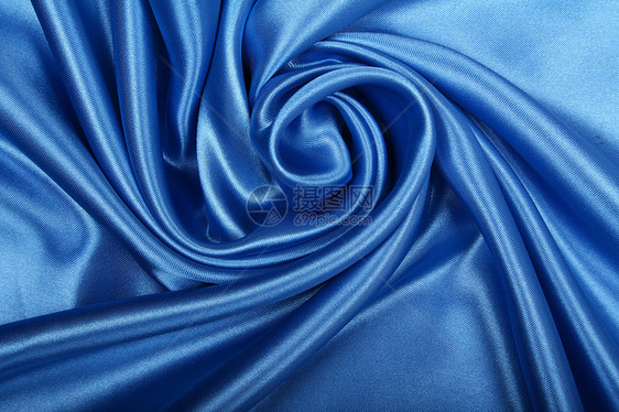 平滑优雅的蓝色丝绸作为背景材料织物投标海浪银色天蓝色纺织品布料曲线折痕图片