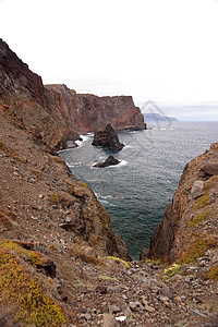 马 提拉小岛水池山脉波浪旅行火山旅游泡沫悬崖海洋图片