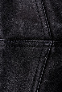 黑色皮革纹理织物纺织品缝纫紧固件颗粒状皮肤口袋金属宏观材料图片