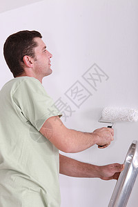 油漆画家白色滚筒头发文件配置男性装修视图房间绘画图片