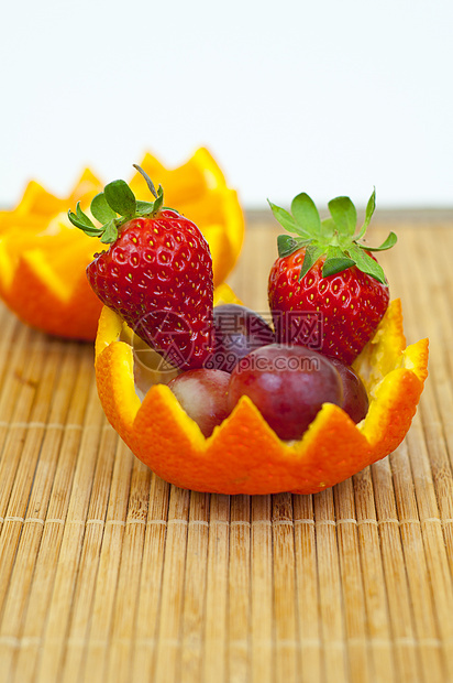 橙子容器中的水果食物盘子饮食牙齿甜点绿色黄色红色图片