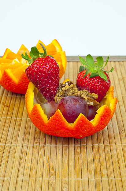 橙子容器中的水果红色牙齿黄色甜点饮食核桃食物盘子绿色图片