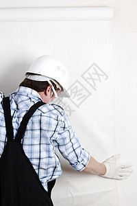附加壁纸活动公寓男人修理工劳动装修抹布装潢师胶水辛劳图片