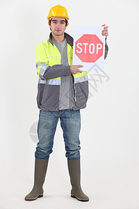 路务工人持有停车牌运输公用事业背心手势蓝色警告信号男性车辆衣服图片
