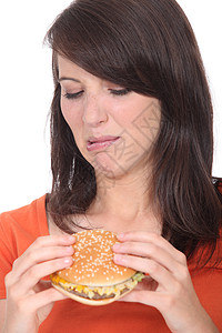 女人吃汉堡包黑发包子食物面包洋葱消化沙拉橙子馅饼头发图片
