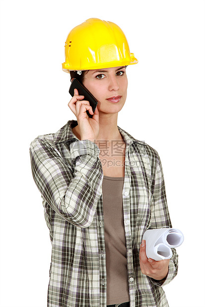 使用移动电话的女商务人士安全建筑工程女士人士商务蓝图绘画电话就业图片