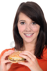 女孩吃汉堡包美味面包食谱烹饪衣服饥饿黑发食欲芝麻圆形图片