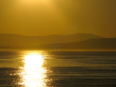 西北太平洋的日落爬坡地平线海滩天空海岸线气候海岸反射天气日光图片