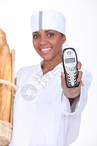 拥有电话的面包工人图片