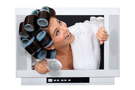 女人在电视上弹出头发卷发机图片