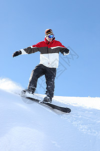 自信的滑雪板寄宿生竞赛运动便车头盔空气滑雪男人夹克特技图片