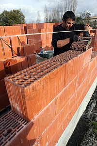 梅森建墙地面工作建筑工人修理细绳水泥材料安装地板图片