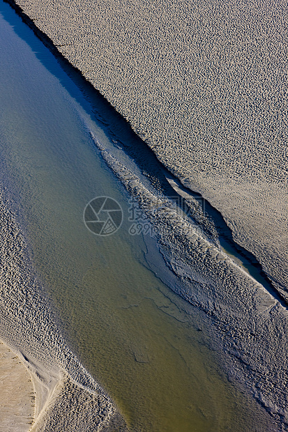 法国诺曼底州蒙特圣米歇尔低潮表面自然外观部门海岸背景图片