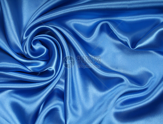 平滑优雅的蓝色丝绸作为背景材料曲线布料纺织品折痕织物海浪银色投标天蓝色图片